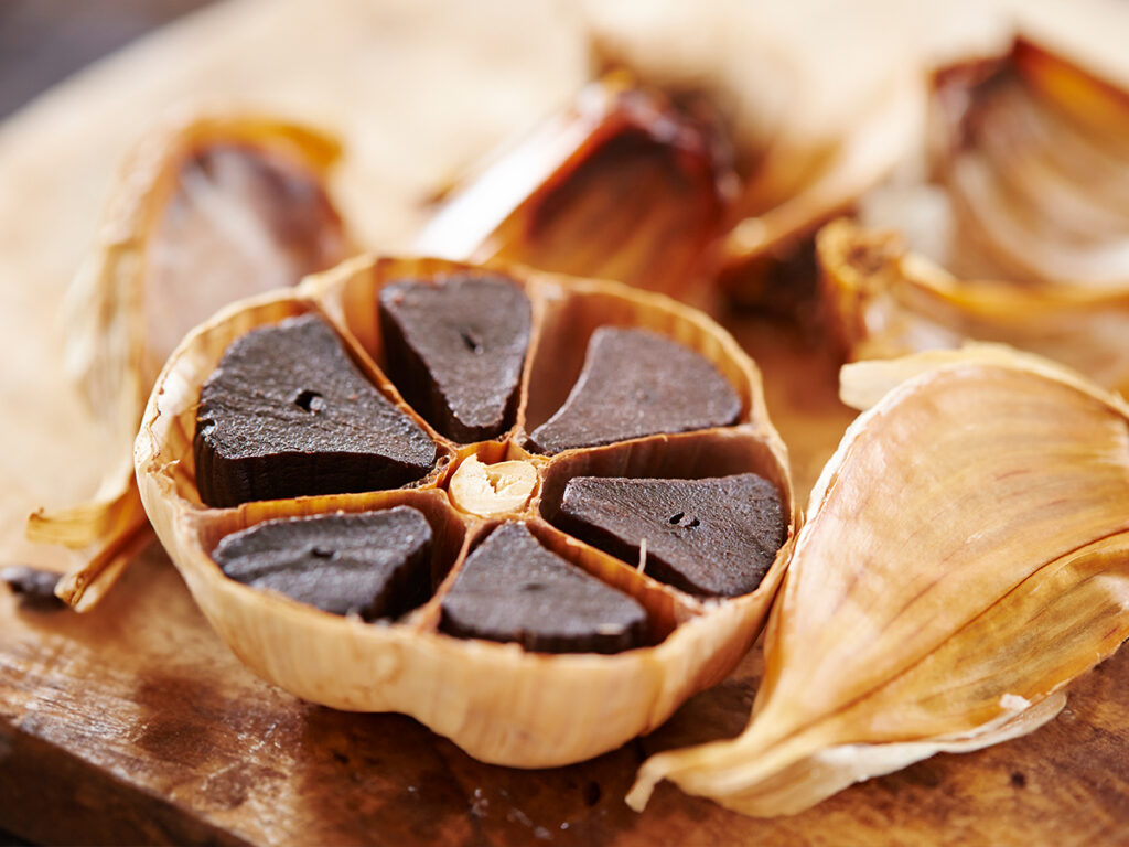 black-garlic-cut-into-half-on-table
